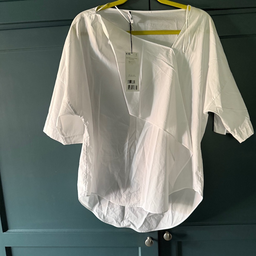 Beautiful white asymmetrical top with tags